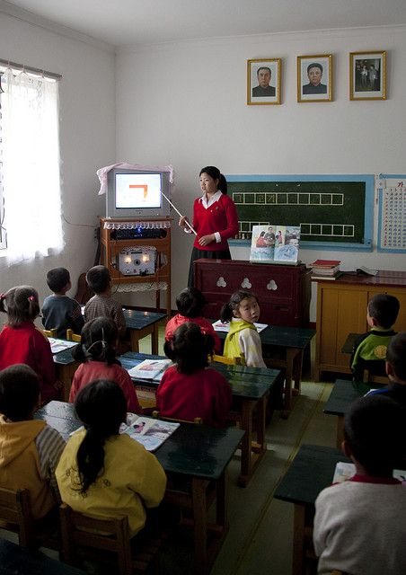 North Korea: The Government makes sure that the education system maintains a basic structure. They do not want schools becoming over populated so they move kids between schools so schools stay clean and have a nice environment for all to learn. Korean Schools Outside, Korean Elementary School, Korean High School Building, Korean Independent School Of Seoul, Country Activities, Korea Country, Korean Life, Inside North Korea, Life In North Korea