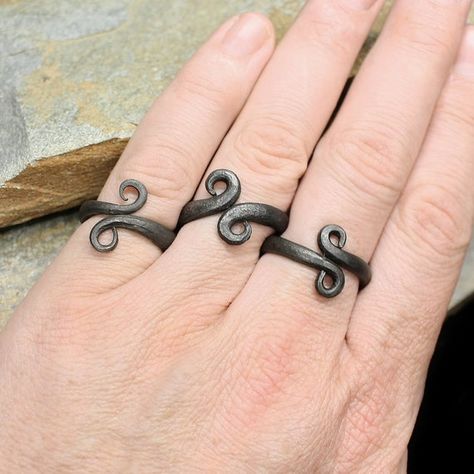 Hand-Forged Iron Viking Ring.Our Viking replica rings are made from hand-forged iron and are direct replicas of genuine Viking finds! Available in 3 sizes, they are ideal for Viking men or Viking women.Hand-forged iron Viking ring in 3 sizes.Small size - weight 5g (0.18oz).Large size - weight 6g (0.2oz)XL size - weight 7g (0.25oz)Non-adjustable, so please check your size before ordering.Ring size guide:Small = 16 - 18mm internal diameter / US size 5.5 - 7.5 / UK size L - PLarge = 20 - 23mm inter Viking Men, Iron Jewelry, Viking Women, Blacksmith Projects, Bf Gifts, Iron Ring, Viking Ring, Hand Forged Iron, Presents For Men