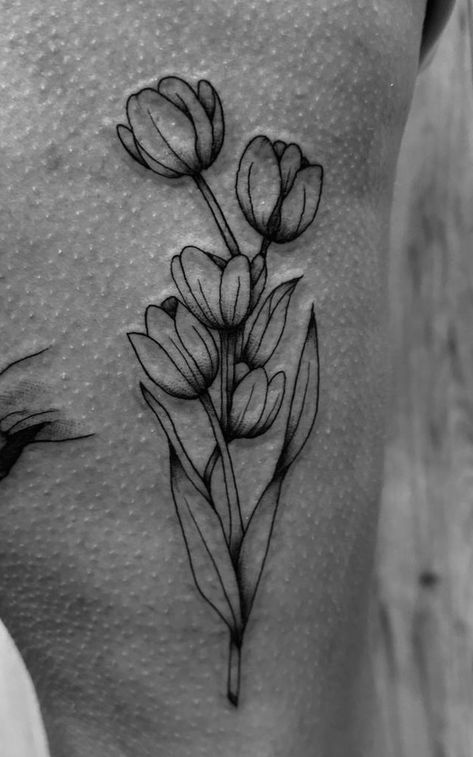 Tulip Tattoo For Men, Tulip Half Sleeve Tattoo, Bunch Of Tulips Tattoo, Tulip Tattoo Design For Women, Black And White Tulip Tattoo, Tulip Sleeve Tattoo, Tulip Sternum Tattoo, Tulip Tattoo Traditional, Tulip Hip Tattoo