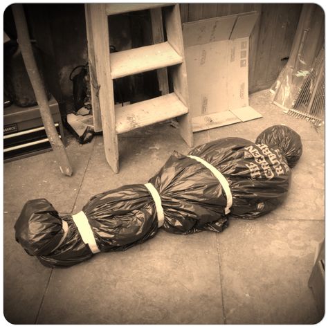 Body in the cellar halloween prop using bin bags and tape stuffed with straw Halloween Prop, Bin Bag, Halloween Props, Halloween Outfits, Straw, Recycling, Textiles, Halloween, Quick Saves