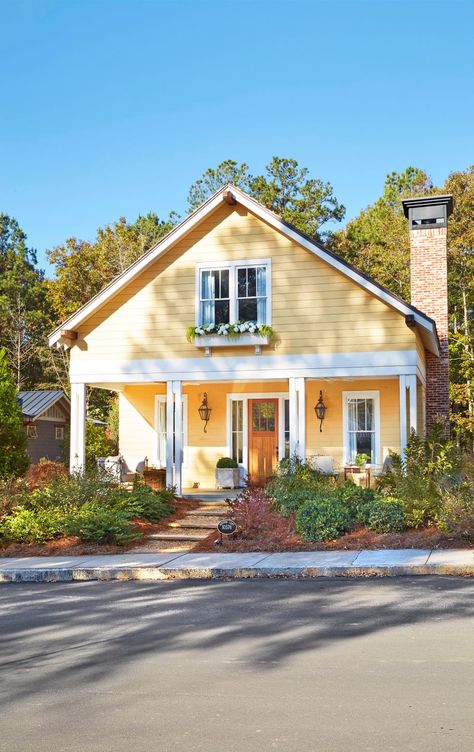 yellow house with white trim Pale Yellow Farmhouse Exterior, Light Yellow House Exterior Paint Colors, Yellow And White House, Yellow Bungalow Exterior, Light Yellow House With Shutters, Yellow House White Trim, Yellow House Black Shutters, Yellow Siding Color Schemes Exterior, Light Yellow House Exterior