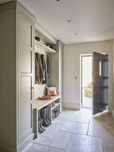 We can’t predict the weekend weather, but we can recommend a boot room. You don’t have to live in a mansion to create a space that keeps muddy wellies, coats and the kids’ shows neat and tidy and the rest of the house clean.⁠ This fabulous boot room features bespoke cabinetry with walnut wood details by #thesecretdrawer, is finished in #blueblood from @paintandpaperlibrary and a reclaimed slate floor. ⁠ ⁠ 📸 | @nickyarsley ⁠ Oak Bench Seat, Boot Room Utility, Natural Stone Floor, Hallway Seating, Utility Room Designs, Secret Drawer, Home Layout, Mud Room Entry, Large Hallway