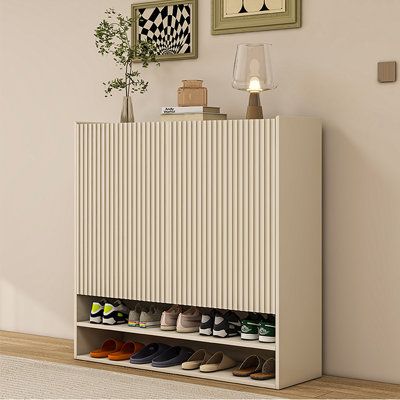 Upgrade your entryway with our Eco-Friendly Wood Multi-Layer Shoe Cabinet. Made from health-conscious and eco-safe multi-layer solid wood, it features adjustable shelves. Ventilation holes ensure breathability, while a polished lacquer finish offers easy maintenance. The wide, edge-wrapped top and open shoe zone combine convenience with tidy aesthetics, complemented by a stylish slatted door design. DICIXA | DICIXA Modern Simple Shoe Cabinet Pair Shoe Storage Cabinet 45.28 H x 39.37 W x 13.78 D Cream Shoe Rack, Mid Century Modern Entryway Shoe Storage, Ikea Entryway Shoe Cabinet, Side Door Shoe Storage, Aesthetic Shoe Cabinet, Shoe Storage Console Table, Hall Shoe Cabinet, Modern Shoe Storage Entryway, Shoe Storage Foyer