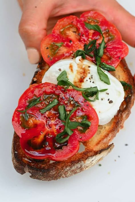 Caprese salad on top of a toasted slice of bread Open Toasted Sandwiches, Caprese Salad Toast, Tomato Caprese Sandwich, Fresh Mozzarella And Tomatoe, Mozarella Tomato Toast, Caprese Bread, Bruschetta With Mozzarella, Mozzarella Tomato Basil Toast, Bruschetta Caprese