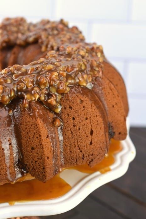 Delicious, moist cinnamon bundt cake with pecan pie filling and topped with a nutty pecan pie topping! This Pecan Pie Bundt Cake recipe is a holiday show stopper, and the perfect Thanksgiving dessert. #thinkfisher #ad Butter Glaze For Cake, Brown Sugar Glaze For Cake, Pecan Pie Bundt Cake Recipe, Pecan Pie Bundt Cake, Fall Breads, Banquet Meals, Moist Cinnamon Cake, Butter Pecan Pound Cake Recipe, Brown Sugar Pound Cake