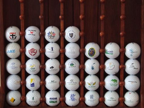 Golf ball collection Golf Closet Organization, Golf Closet, Bar Golf, Golf House, Simulator Room, Golf Simulator Room, Golf Ball Displays, Golf Clubhouse, Ball Display