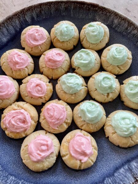 Thumbprints with Buttercream Frosting Cream Cheese Thumb Print Cookies Recipes, Frosted Thumbprint Cookies, Buttercream Thumbprint Cookies, Thumbprint Cookies With Frosting, Almond Flavored Cookies, Iced Thumbprint Cookies, Crumbl Recipes, Thumbprint Cookies With Icing, Flavored Cookies