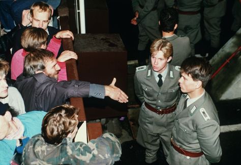 East German border guards refusing to shake hands at Checkpoint Charlie. Checkpoint Charlie, German Police, Border Guard, German Men, The Berlin Wall, German Soldiers Ww2, East Berlin, Berlin Wall, History Pictures