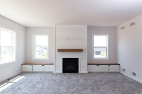 Fireplace With Windows And Built Ins On Each Side, Built In Around Fireplace With Windows, Fireplace Between Two Windows Built Ins, Built Ins Under Windows Next To Fireplace, Wall Built Ins Living Room Vaulted Ceiling, Window Seat Beside Fireplace, Fireplace With Built In Benches, Built In Between Windows, Built In Bench Living Room Fireplace