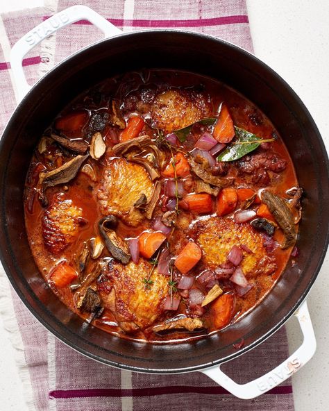 Easy Weeknight Dutch Oven Coq Au Vin Recipe. Looking for recipes and ideas for classic french cooking dinners and meals? This simple comfort food is delicious; something Ina Garten or Julia Child would make for dinner parties. You'll need bone-in chicken thighs, mushrooms, pancetta or bacon, onion, garlic, carrot, tomato paste, red wine, chicken broth, bay leaves, thyme sprigs, parsley Coq Au Vin Recipe Easy, Coq Au Vin Recipe, Roasted Chicken Breast, Cooking Advice, French Cooking, Chapati, Chicken Thigh Recipes, Garam Masala, Easy Chicken