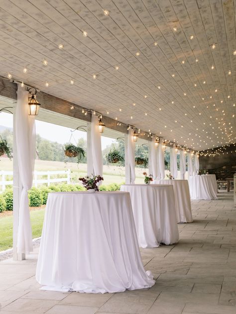 High Top Tables with low, petite floral arrangements on outdoor, covered patio veranda. Wedding venue with views of the Catskills in upstate New York. Outdoor Cocktail Hour Wedding, Cocktail Hour Tables, Veranda Wedding, Patio Veranda, Outdoor Cocktail Hour, Outdoor Covered Patio, Outdoor Cocktail, Cocktail Hour Wedding, The Catskills