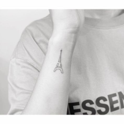 Single line Eiffel Tower tattoo located on the wrist. Continuous Line Tattoos, Eiffel Tower Tattoo, Tower Tattoo, Tattoo On The Wrist, Continuous Line Tattoo, Mo Ganji, Paris Tattoo, Back Of Arm Tattoo, Single Line Tattoo