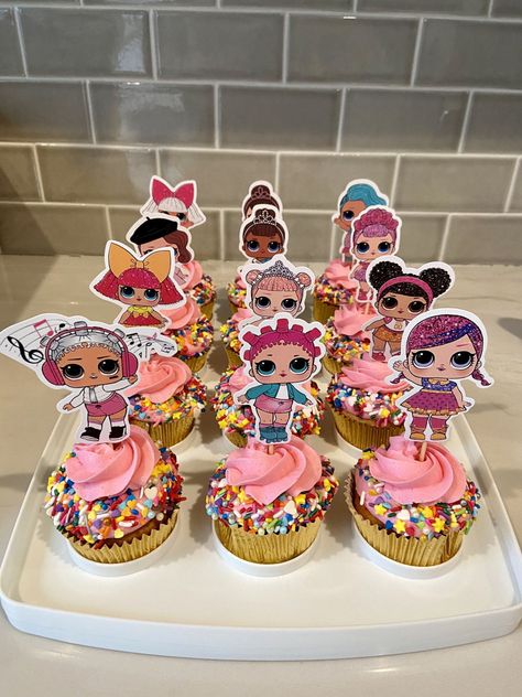 Lol Surprise Cupcakes Cupcakes topped with buttercream and sprinkles and a paper cupcake topper Lol Pull Apart Cupcake Cake, Lol Surprise Dolls Cupcakes, Lol Birthday Cupcakes, Lol Doll Cupcakes, Lol Doll Cupcake Ideas, Lol Surprise Cupcakes, Lol Cupcake Ideas, Lol Birthday Cake Ideas, Lol Theme Cake