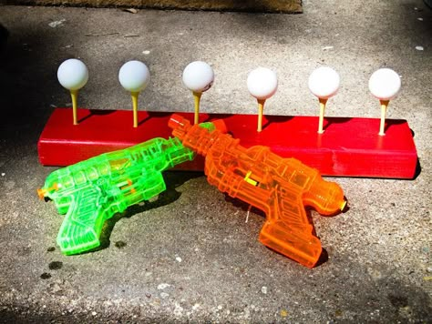 Summer fun - knock ping pong balls off golf tees with water guns  camping fun, bug out fun, summer nights, things to do with kids in an emergency Circus Carnival Party, Ping Pong Balls, Backyard Games, Camping Games, Carnival Games, Golf Tees, Camping Fun, Camping Ideas, Backyard Fun