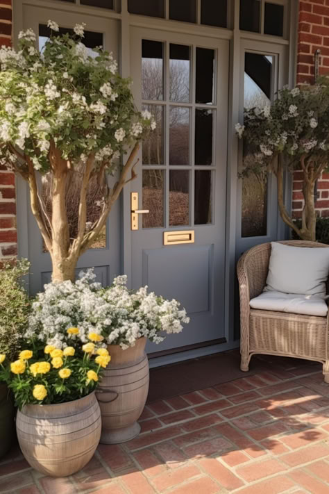 40+ Farmhouse Spring Porch Decor Ideas for Your Home Farmhouse Exterior Entry, Spring Patio Ideas, Brick Home Front Door, Dresser On Front Porch, Small Front Stoop Ideas, Wooden Front Porch Ideas, French Country Front Porch Ideas, Farmhouse Doors Exterior Front Entrances, English Cottage Front Door