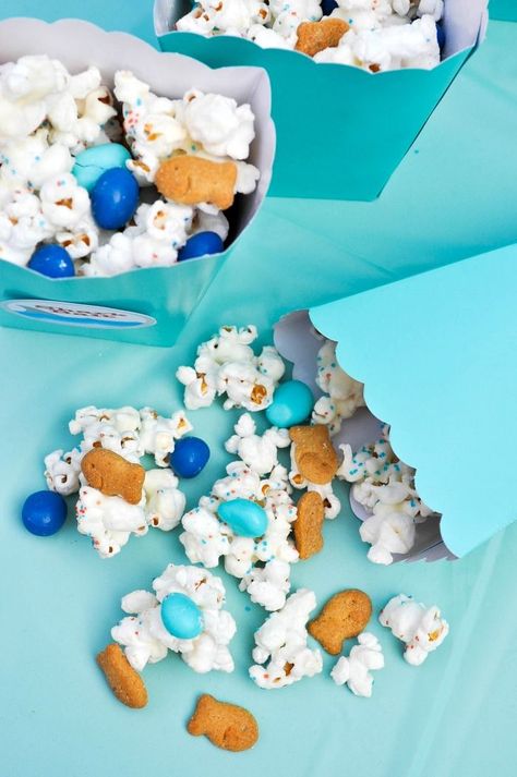 Throwing an ocean themed party? You will definitely want to include this Ocean Party Popcorn mix we made as a Shark Party Snack. It's the perfect sweet and salty snack mix that everyone will love! | The Love Nerds Whale Baby Shower Cake, Party Mix Snacks, Party Popcorn, Ideas For Food, Popcorn Mix, Ocean Birthday Party, Ocean Theme Party, Food Decorations, Ocean Birthday