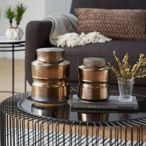 It’s easy to overlook something like a coffee table when redoing your living room. And it’s no wonder since most effort typically goes toward expensiv... | Top Your Tables with Bronze Jars Unique Jars, Rattan Coffee Table, Boho Chic Style, Boho Bedding, Ceramic Jars, Contemporary Ceramics, Gold Wood, Ceramic Materials, 7 H