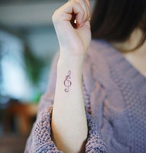 150+ Meaningful Treble Clef Tattoo Designs for Music Lovers (2021) Small Music Tattoos, Treble Clef Tattoo, Meaningful Wrist Tattoos, Simple Tattoos For Women, Tato Henna, Circle Tattoos, Small Tattoos With Meaning, Music Tattoo Designs, Wrist Tattoos For Guys