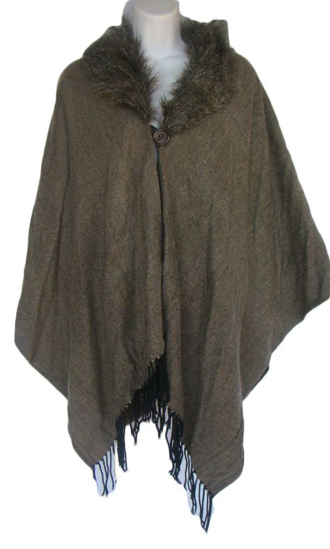 This cape is new with tags. Brown with faux fur trim. Fringed in the front. One button closure. The size is O/S . Very generous bust, 27" - 33" in length. 100% acrylic. Fur Poncho, Buck Skin Clothing, Hippie Brown Poncho For Winter, Cozy One Size Brown Cape, Fall Poncho With Faux Fur Trim Cape, Cozy Brown Hooded Poncho, Medieval Fur Cloak, Viking Fur Cape, Outfit Inso