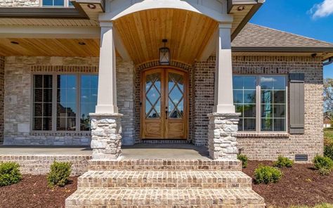 Mixing stone and brick front porch Brick Front Porch, Brick And Siding Exterior, Horizon Stone, Front Porch Pillars, Front Porch Stone, Porch Pillars, Front Porch Columns, Stone Porches, Exterior Color Palette