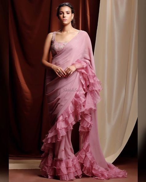 Trendy ruffled saree perfect for your wedding functions.   #ruffledsaree #sareeinspiration #sareeinspo #weddingsaree #shaadisaga #shaadisagafashion Ruffle Sarees Latest, Ruffled Saree, Ruffle Sarees, Indian Sari Dress, Beautiful Sarees, Ruffle Saree, Saree Gown, Boho Dresses Long, Simple Sarees