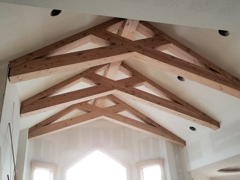 Check out this custom-designed vaulted ceiling with scissor trusses in one of our #BLRieke homes in progress! 😍🏠 Not only do they look amazing, but they also help make the space feel bigger and more open! #customdesigned #vaultedceiling #ceilingtrusses #exposedbeams #woodbeams #scissortruss #ceilingbeams #custom #design #customdesign #customhome #dreamhome #homedesign #homebuilder #interiordesign #customhomedesign #customhomebuilder #homeconstruction #homebuilding #blriekecustomhomes Types Of Trusses, Scissor Truss Ceiling Living Rooms, Scissor Truss Vaulted Ceiling, Scissor Trusses Ceiling, Exposed Scissor Truss Ceiling, Scissor Truss Ceiling Beams, Scissor Beams, Wood Truss Ceiling, Scissor Truss Ceiling