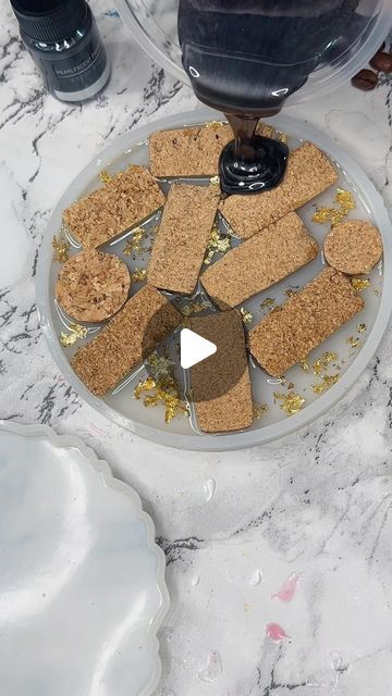 Resin About | Katherine Price on Instagram: "Well you guys enjoyed the last reel of this make so here’s a slightly different version...this collection of handmade coasters featuring wine corks and mesmerizing gold leaf on sleek black shimmering resin - Finished piece shown at the end 🖤✨  These coasters are a beautiful fusion of classic and contemporary design. Each coaster is meticulously handcrafted, incorporating real wine corks that bring a touch of rustic charm. The wine corks are showcased within a striking black resin, adorned with luxurious gold leat accents, creating a stunning contrast that catches the eye.  Set the stage for your next wine tasting or gather around with friends for a refreshing cocktail - these coasters are the perfect conversation starter.  Elevate your sips in Cork Art Projects, Crafts With Wine Corks, Wine Cork Coasters, Cork Crafts Christmas, Resin Creations, Refreshing Cocktail, Wine Cork Crafts, Resin Ideas, Wine Corks