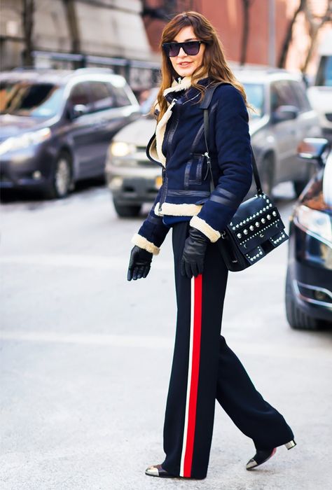 Trend Report: The New Sport-Luxe Trousers via @WhoWhatWearUK Side Stripe Trousers, Sport Food, Athleisure Trend, Stripe Outfits, Sports Luxe, Looks Street Style, Red Pants, Sport Chic, Hippie Chic