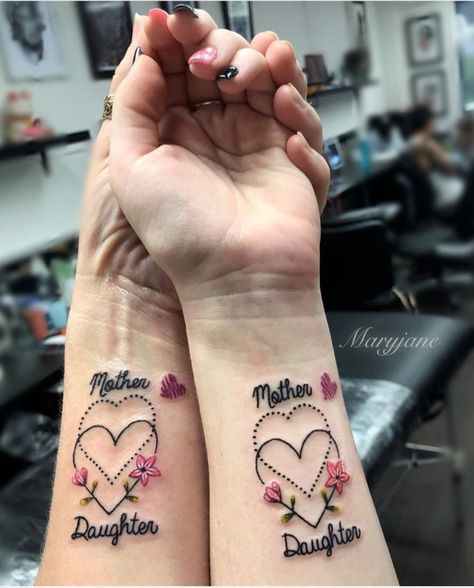 30 Mother-daughter tattoos that celebrate the most special bond of all | MamásLatinas Mum And Daughter Tattoo, Mommy Daughter Tattoos, Girl Finger Tattoos, Tato Mandala, Mom Daughter Tattoos, Tattoo Placements, Small Finger Tattoos, Tattoos With Kids Names, Mommy Tattoos