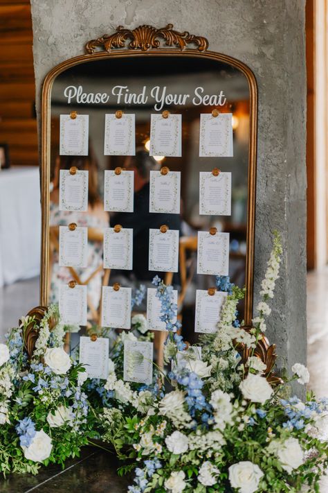 Seating Chart Flowers Wedding, Light Blue Wedding Seating Chart, Light Blue And Sage Wedding Theme, Hydrangea Seating Chart, Seating Chart On Mirror Wedding, Blue And White Wedding Seating Chart, Blue Accent Wedding Decor, Dusty Blue Wedding Theme Flowers, Wedding Seating Chart Flowers