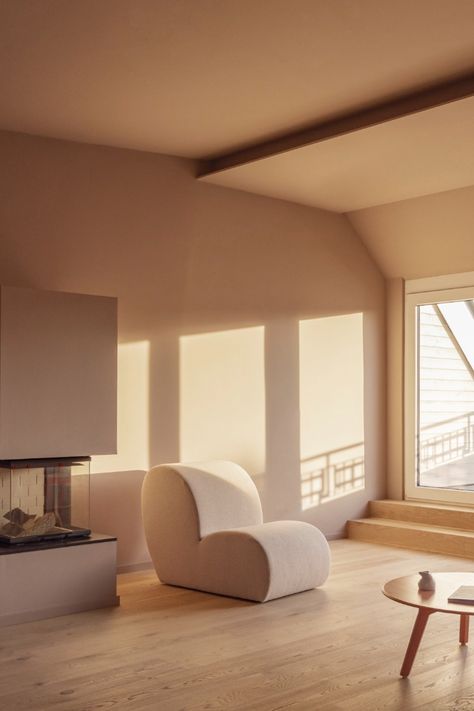 Skylights and oversized windows bathe the Berlin apartment at golden hour, but no matter what the time, living spaces ripple with colour and character. Photography: Fantastic Frank. #interiors #interiorstyle #interiordesign #berlin #germany #property #architecture #minimalism #minimalinteriors #livingroom #fireplace #chair Sunlight Interior, Light And Shadow Interior, Sunset Interior, Golden Hour Living Room, Golden Hour Interior Design, Interior Rendering Architecture, Golden Hour Interior, 3d Render, Sun Light Architecture