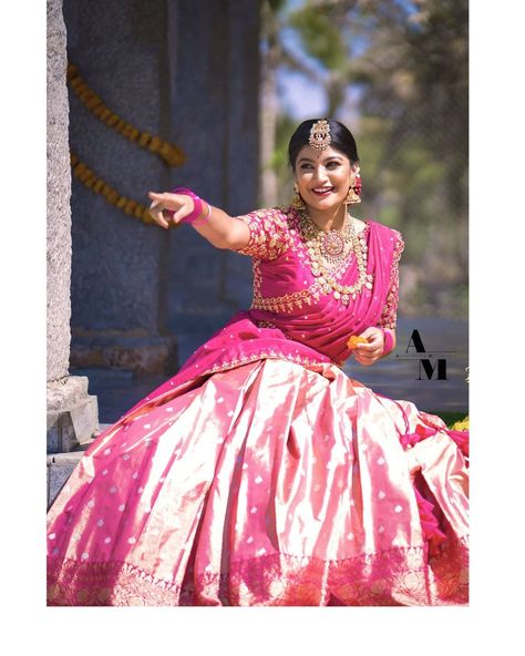 Aishwarya & Madhumika on Instagram: “Presenting you , our very own "AADHYA" 2021 - collection Coral Pink Double shaded Lehanga ensembled with heavy embroidered blouse paired…” Mehendi Saree, Pink Half Sarees, Pattu Lehenga, Half Saree Function, Langa Voni, Photo Graphy, Latest Bridal Blouse Designs, Lehenga Design, Bride Hairstyle