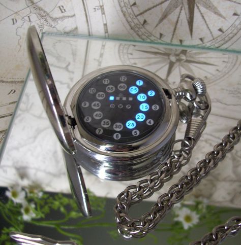 Stainless steel pocket watch with a blue LED display. Traditional with a science fiction, steampunk twist. See it an others on our Etsy Shop. Fantasy Watch, Digital Pocket Watch, Futuristic Watches, Mechanical Pocket Watch, Steampunk Accessories, Magical Jewelry, Watches Unique, Fantasy Jewelry, Led Display