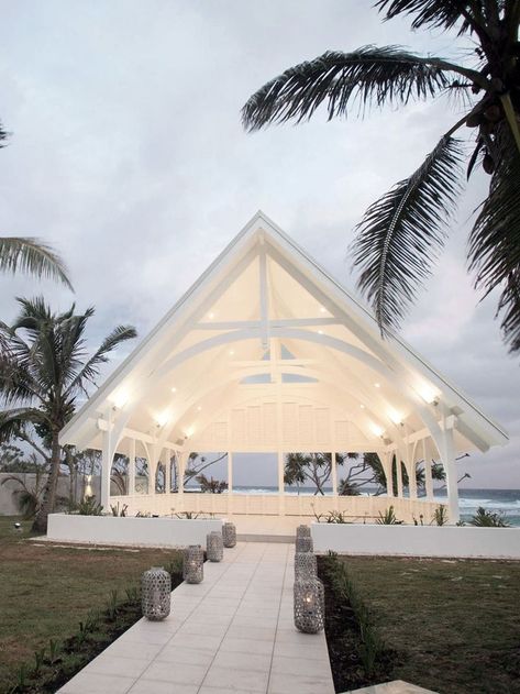 Read our edit of beach wedding venues including this white outdoor chapel found on the shores of an exclusive island resort. #outdoorchapel #beachceremony #beachwedding Outdoor Wedding Pergola Ideas, Open Chapel Design, Resort Function Hall, Wedding Venues Usa, Open Chapel, Outdoor Wedding Beach, White Greenhouse, White Pavilion, Garden Chapel