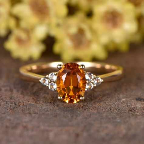 Amber Oval Topaz Ring For Wedding, Yellow Sapphire Ring With Prong Setting For Weddings, Yellow Gold Citrine Diamond Ring For Anniversary, Anniversary Yellow Gold Citrine Diamond Ring, Citrine Diamond Ring In Yellow Gold For Anniversary, Yellow Gold Wedding Ring With Yellow Sapphire, Elegant Yellow Sapphire Wedding Ring, Anniversary Citrine Diamond Ring With Accent Stones, Luxury Citrine Wedding Rings