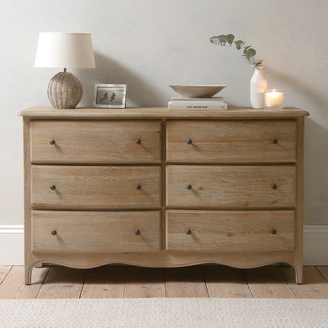 Appealing curves, a hand-applied limewash finish and an elegant French-inspired design all serve to make this superbly crafted chest a must-have addition for both modern and traditional bedrooms. With two rows of 3 drawers to keep you organised, it’s been made from solid oak and premium quality oak veneers. The wide top will house a mirror or make an ideal spot to display some photographs or ornaments, and the carved base adds sophisticated detail. Antique-style button handles add a smart finish Cotswold Company, Low Chest Of Drawers, Traditional Bedrooms, Bedroom 2024, Wide Chest Of Drawers, Chest Of Drawers Bedroom, Loft Bathroom, Bedroom Chest Of Drawers, Bedroom Drawers