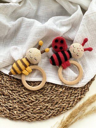 When using the indicated materials the approximate size would be: the length of the bee - 13 cm (with antennas), the length of the ladybug - 12 cm (with antennas). ABOUT PATTERN: - row-by-row crochet instruction - detailed instructions and pictures on how to crochet these toys - how to assemble all the parts to make these toys - all yarn parameters - my help at any step - includes 20 pages - more than 65 photos - printable PDF LEVEL - Suitable for Beginners. #crochetbaby #babyrattle #teether Bee And Ladybug, Crochet Teether, Ladybug Pattern, Crochet Nursery Decor, Baby Teether Toys, Crochet Panda, Baby Toys Rattles, Crochet Bee, Toys Crochet