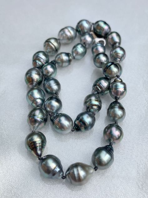 Large, Baroque, Circled, Tahitian Pearl Necklace This necklace is knotted with black thread and finished with a white gold clasp.  It measures 17 inches long. The pearls range from 11-15mm. Very large pearls!  A truly beautiful gift for someone special or for yourself! Baroque Tahitian Pearl Necklace, Tahiti Vacation, Black Pearl Jewelry, Tahitian Pearls Jewelry, Large Pearl Necklace, South Sea Pearls Earrings, Tahitian Pearl Necklace, Pearls Jewelry, Black Pearl Necklace