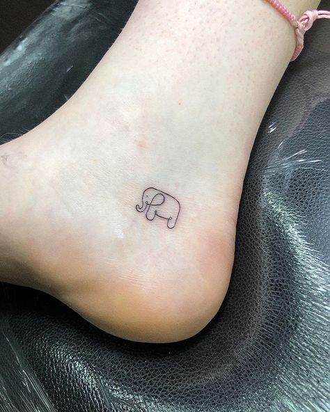 50 Amazingly Small Micro Tattoos That Make a Big Impression | Micro Tattoos A teeny-tiny tattoo can make an outsized impact. Take a look at these stunning micro tattoos. Culture Elephant Micro Tattoo, Micro Tattoos For Women, Tiny Elephant Tattoo, Tiny Tats, Gem Tattoo, Airplane Tattoos, Petite Tattoos, Fire Tattoo, Tiny Elephant