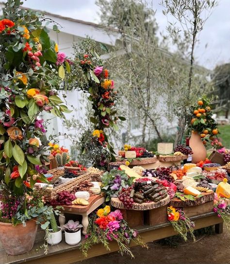 Grazing Table at Events: Inspiration and Tips | BizBash Garden Party Cheese Board, Charcuterie Garden Party, Floral Grazing Table, Grazing Table Flowers, Grazing Table With Flowers, Garden Party Buffet, Small Garden Party Ideas, Charcuterie Tables, Chic Engagement Party