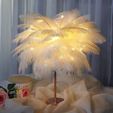 Description Warm Feather Night Light - Embrace Cozy Comfort and Gentle Glow 🌙🪶 Transform your space into a haven of warmth and relaxation with the Warm Feather Night Light. Designed to bring both comfort and style, this unique night light creates a soothing, gentle glow that brings peace and serenity to your bedroom, living room, or any cozy corner of your home. 🪶 Elegant Feather Design for a Cozy Ambiance This night light features a beautifully crafted feather design that evokes a sense of s