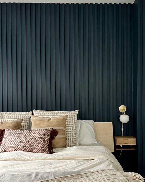 "{We love the depth and texture that this painted wood slated wall brings to the room. The vertical slats make the space looks so much bigger 😱 The clients wanted a color that would pop so we went with Newburyport Blue from @benjaminmoore and we absolutely love it! Check out our insta for the before of this room}" #customwoodwork #paintedwoodslatwall #woodslatedwall #bedroom #bedroomideas #details #accentwallideas Modern Slat Wall Bedroom, Painted Wall Slats, Painted Fluted Wall, Vertical Slat Accent Wall, Navy Slat Wall, Painted Wood Slat Wall, Accent Wall Vertical Wood, Slate Wall Bedroom, Wood Slated Wall