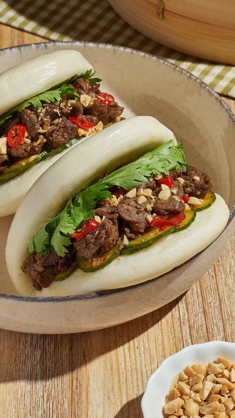 New obsession unlocked🤤 Check out the full recipe for Beyond Steak Gua Bao below! @erictriesit INGREDIENTS: 2 tbsp soy sauce 1 tbsp rice vinegar 2 tsp sesame oil 2 cloves of garlic, minced 2 tbsp gochugaru (Korean chili flakes) 1 tbsp sugar 4 mini cucumbers, thinly sliced 1 package Beyond Steak® (10 oz. / 283g) 1 red chili, sliced 3 tbsp low-sodium soy sauce 2 tbsp raw sugar 6 gua bao buns 1 cup of cilantro 1/4 cup roasted peanuts, chopped PREPARATION: 1. In a large bowl stir together the s Vegan Bao Buns, Beyond Steak, Vegan Bao, Korean Chili Flakes, Gua Bao, Korean Chili, Sausage Rice, Vegan Kimchi, Spicy Dipping Sauce