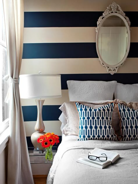 Navy & Grey & White:  The thick striped wall instantly lifts this bedroom  and adds dimension to an otherwise bland palette. Coastal Chandeliers, Coastal Sofa, Crazy Tricks, Coastal Office, Bold Bedroom, Minimalist Dekor, Apartment Makeover, Striped Walls, Paint Modern