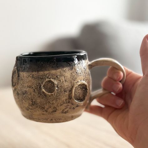 Moon mug 🌙 This mug actually was a quick make. It took me about one hour starting from slabs that I formed to be a spherical cup. The texture was applied with a rock and the big craters were modeled in clay. I emphasized all the little nooks and crannies by applying black underglaze and it came out so much like I expected it which about never happens with pottery stuff! (at least for me) I love the moon mug too much, so of course I kept this piece. It will not be my last moon mug, but thi... I Love The Moon, Moon Mug, Nooks And Crannies, Be My Last, A Rock, My Last, Too Much, The Moon, Take That