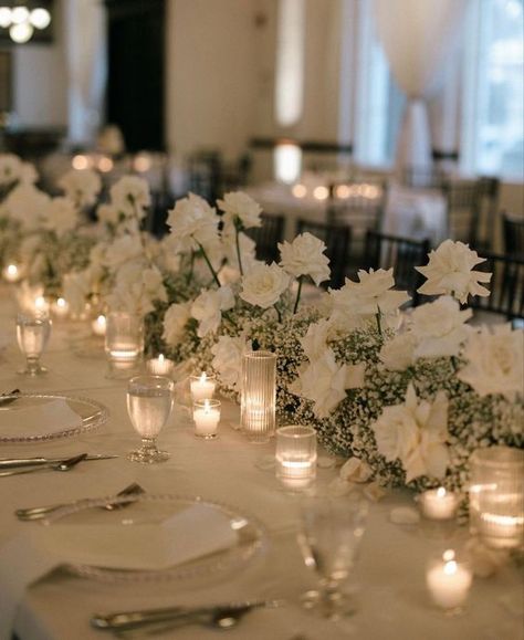 Classic White Wedding Theme, Long Table Wedding Centerpieces Candles White Flowers, White Flowers And Candles Wedding, Modern Minimalist Wedding Table Decor, Neutral Wedding Aesthetic, Wedding Theme Ideas Elegant Indoor, White Roses Centerpieces Wedding, Vintage Classic Wedding Aesthetic, Classy Wedding Flowers