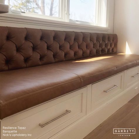 A stunning tufted banquette upholstered in our Resilience Topaz by @nicks_upholstery. Nick ensured the seat cushion was perfectly flush with the adjacent cabinets and that the back didn't extend over the window ledge. With the table and chairs now in place,this space is a perfect breakfast nook for cozy family dinners or entertaining guests. #garrettleather #nicksupholstery #interiordesign #banquette #kitchendining #leatherbanquette #breakfastnook #diningroom #leathercraft #leatherupholstery... Upholstered Dining Banquette, Velvet Breakfast Nook, Banquet Seating Kitchen, Diy Booth Seating, Counter Height Banquette, Banquette Seating With Storage, Basement Seating, Upholstered Banquette Seating, Diy Banquette Seating