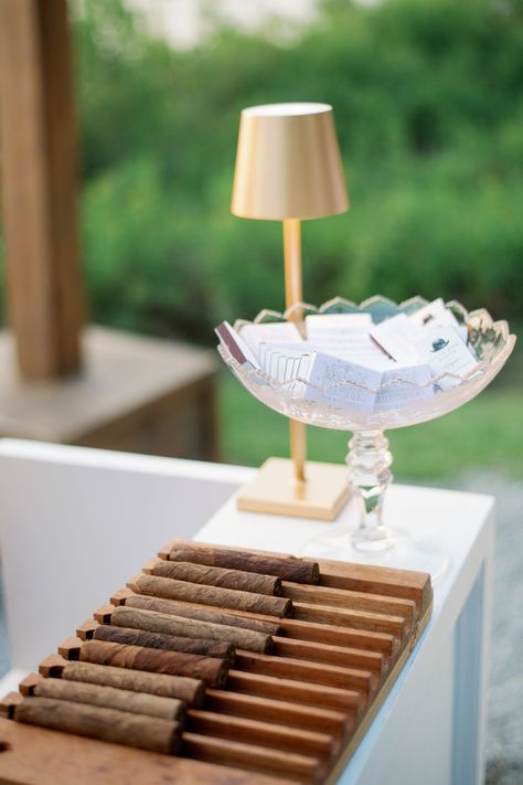 Cigar roller? We make the best matchbooks to go with! . . . . #koozie #weddingkoozie #chs #studiordesign #charlestonwedding #charlestonbride #lowcountrywedding #weddinginvitations #graphicdesigners #southernwedding #weddingideas #southerncharm #dreamwedding #brides #weddingcrest #weddingfavors #matchbook #weddingcigar #weddingmatches #cigarroller #weddingcigarroller Cigars At Wedding, Wedding Bar Accessories, Wedding Cigars Ideas, Raw Bar Wedding, Wedding Matchbooks, Wedding Personal Touches, Matchbooks Wedding, Gold Lamps, Wedding Cigars