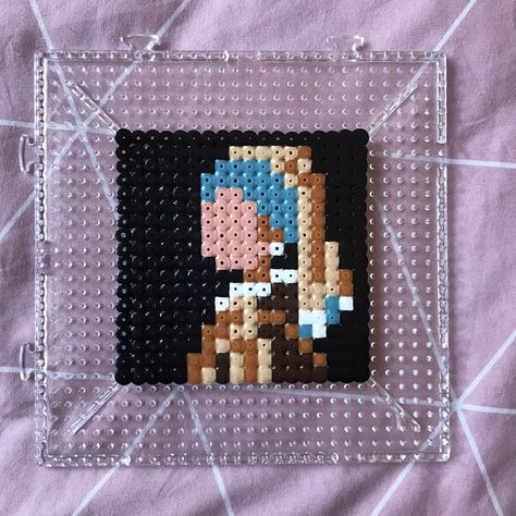 Vermeer’s masterpiece painting Girl With a Pearl Earring made from perler beads. 8 bit pixel art style Perler Beads Painting, Perler Beads Artwork, Tv Girl Perler Beads, Painting Perler Beads, Perler Bead Aesthetic, Perler Bead Painting, Art Perler Beads, Perler Beads Art, 8 Bit Pixel Art