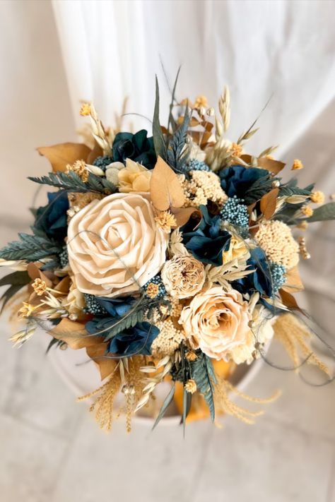 A wonderful Golden Ocean Breeze Wedding Bouquet that will bring joy and beauty for a very long time. Thanks to completely natural materials and processing, the flowers retain their luxurious appearance and even a light aroma. This incredibly aesthetic decoration will create that wonderful festive and cozy atmosphere. Can be used as a decoration for a wedding, or another party, or as decor anywhere. Bridal Bouquet Dusty Blue, Gold And Navy Blue Wedding, Boho Bridesmaid Bouquet, Flowers Baby Breath, Navy Blue Wedding Bouquets, Bouquet Dusty Blue, Boho Dried Flowers, Wedding Bouquet Winter, Winter Bridal Bouquets